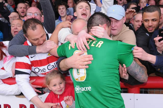 Billy Paynter celebrates with Rovers fans