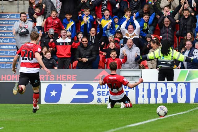 Doncaster's Harrison Biggins celebrates his goal to make it 3-2 against Barrow. (Picture:Andrew Roe/AHPIX LTD)