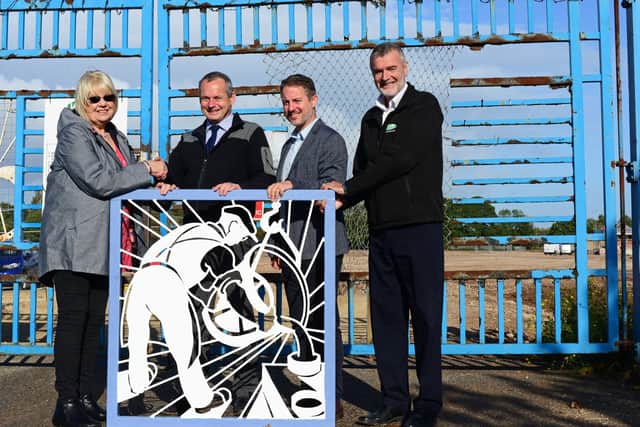 Brendan Carty, Harworth Group project manager, Duncan Armstrong, Harworth Group Associate Director and Richard Blakey, VHE Contracts manager, pictured presenting Susan Stephenson, with the restored gate panel. NDFP-08-10-19-RiverdalePark-3