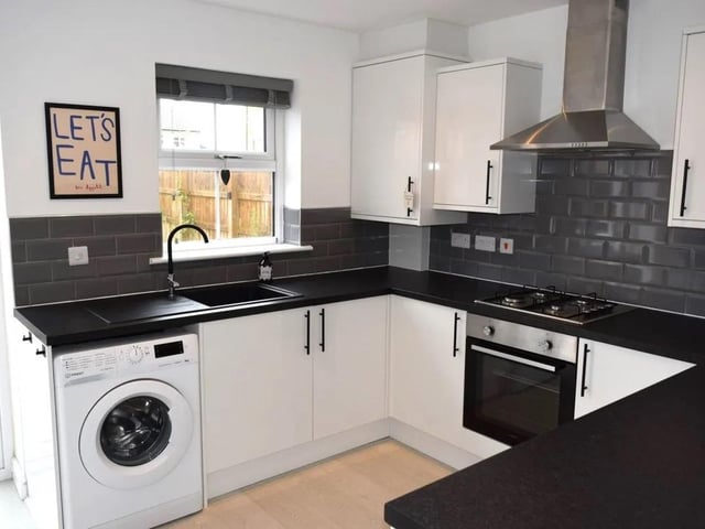 The kitchen has fitted units and some integrated appliances.