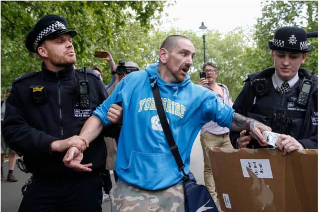 Phillip Anthony Hartley, who also uses the name Phillip L'Estrange, pictured after his arrest at a demo in London in May, is facing charges of assaulting police.