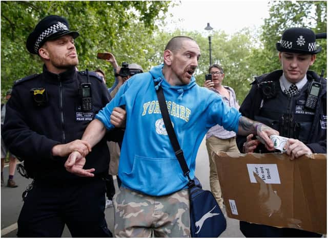 Phillip Anthony Hartley, who also uses the name Phillip L'Estrange, pictured after his arrest at a demo in London in May, is facing charges of assaulting police.