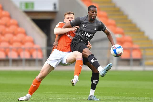 Fejiri Okenabirhie (right) in action for Doncaster at Blackpool in May 2021. Photo: Dave Howarth/CameraSport.