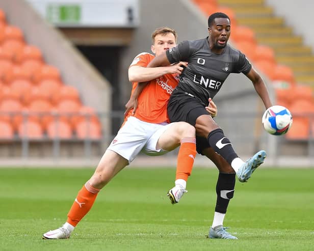 Fejiri Okenabirhie (right) in action for Doncaster at Blackpool in May 2021. Photo: Dave Howarth/CameraSport.