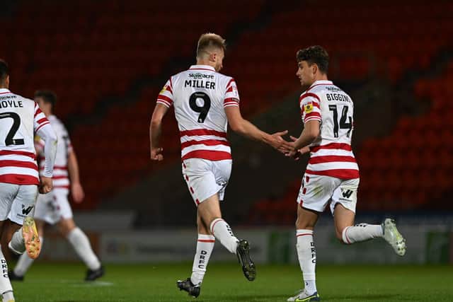 George Miller celebrates his consolation goal with Harrison Biggins.
