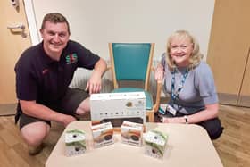 Matt Sharp and Lindsey Richards with the security equipment he’s donated