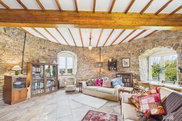 A stunning room inside the round stone walls of the old mill.