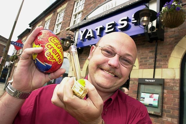 Doncaster Yates' head of promotions, Saul, shows off their special Easter cocktail - a Cadbury's Creme egg and Tequila slammer, April 2001