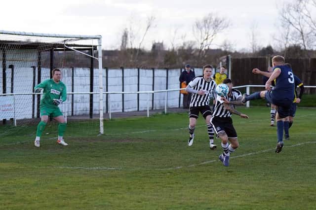 Jordan Timmons scores the winner for Harworth Colliery. Photo: John Mushet