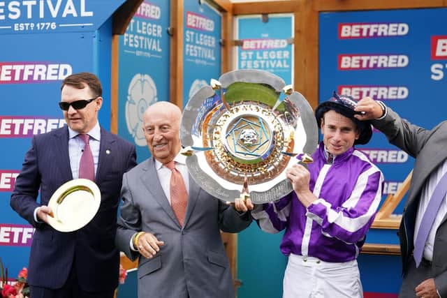 Master: Aidan O'Brien, left, and Ryan Moore, right with Fred Done, founder of Betfred, the sponsor of the St Leger.