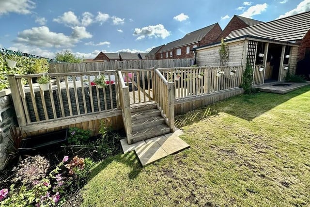 An enclosed area of decking is ideal for spending time outside in the summer.
