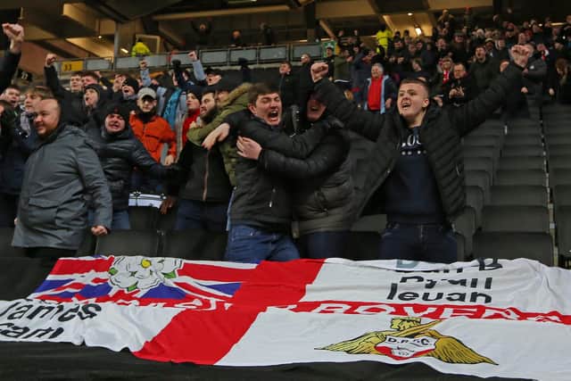 Doncaster Rovers fans celebrate the victory at MK Dons.