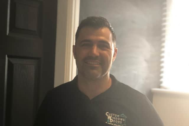 Shane Miller, owner of Custom Windows and Doors opened the doors to his business during the floods so that residents could have a safe place to dry off.