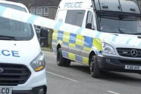 A road in Doncaster has been sealed off after shots were fired.