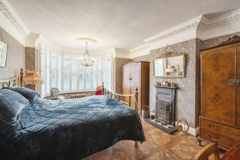 A bay-fronted double bedroom on the first floor of the townhouse.