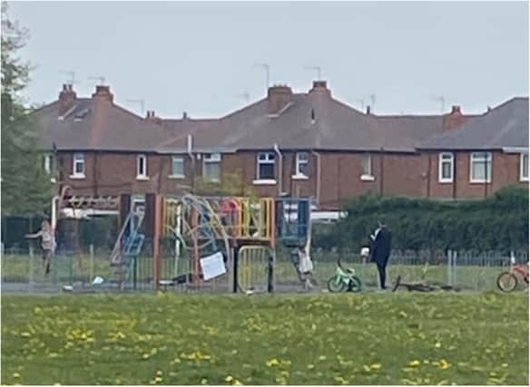The woman was spotted lifting children into the play area in Bentley.