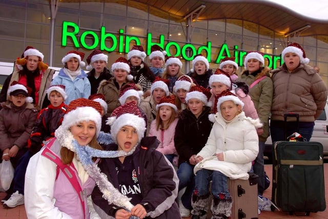 The Adwick Children's Choir who flew from Robin Hood Airport to Prague yesterday (30 Nov), where they performed their songs in front of the City's Mayor. In the foreground are Stephanie Clifton, aged 14, and Joe Craswell, aged nine.
