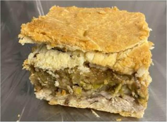 The festive pie features turkey, stuffing, sprouts, cranberries and pigs in blankets.