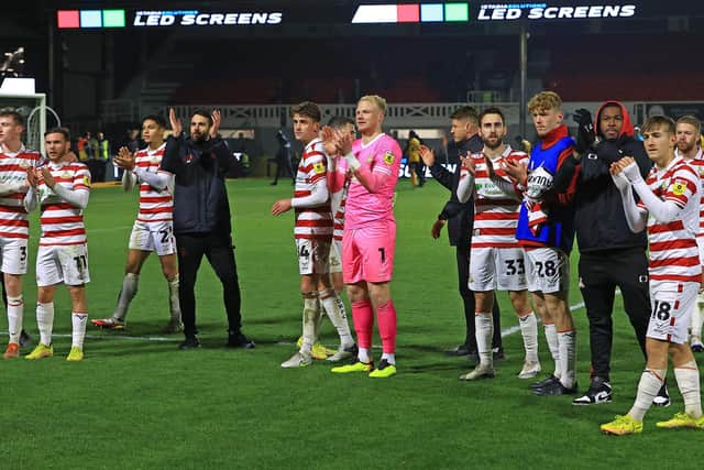 Doncaster Rovers' players celebrate their win over Newport County.