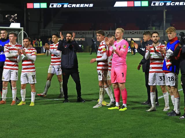 Doncaster Rovers' players celebrate their win over Newport County.