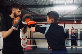 Woodlands warrior Jason Cunningham puts a Ridgewood School pupil through his paces. Photo: Louis Jo