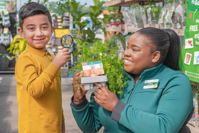 Adam Hamidshoot, aged 6 and Olivia Smith, Customer Assistant at Morrisons launch the ‘It’s Good to Grow’ campaign, Photo: Rick Walker/PA Wire