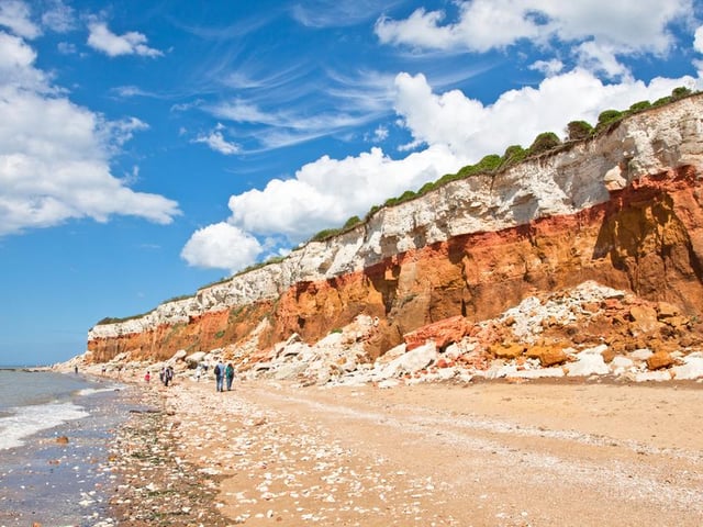 Known for its striking red and white striped cliffs, Hunstanton Beach runs for two miles and has an abundance of rock pools where visitors can hunt for fossils among the rocks and shingle.
