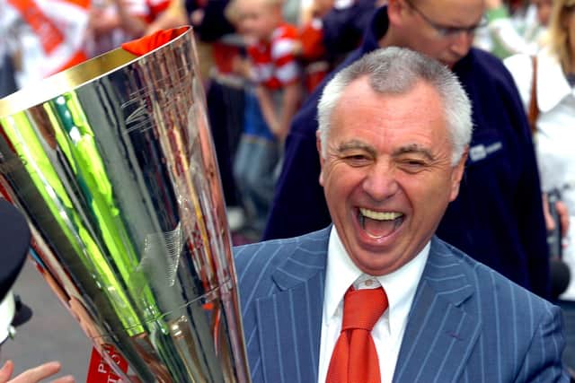 Ex-Rovers chairman John Ryan holds aloft the Johnstone's Paint Trophy in 2007.