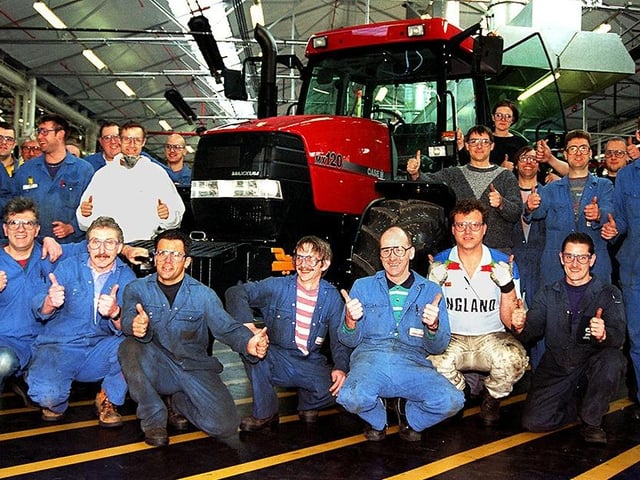 Case workers celebrate their company's announcement of a huge investment programme in Doncaster in May 1997. The tractor in the picture is a Maxxam 120 horsepower vehicle.