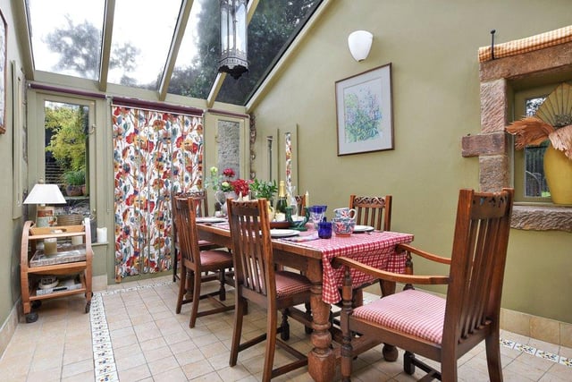 The breakfast room provides a dining space but also has French doors opening to the garden.