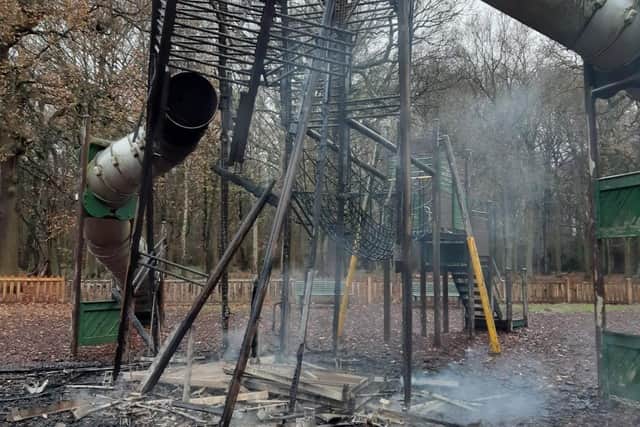Smouldering remains of the former playground after an arson attack