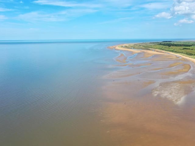 This pretty beach in the cute village of Old Hunstanton features golden sands, that are backed by dunes and the striking striped cliffs, and is a popular spot among wind and kitesurfers.