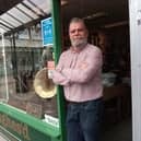 Chris Hughes outside his Hughes'd antiques shop which he has re-opened today
