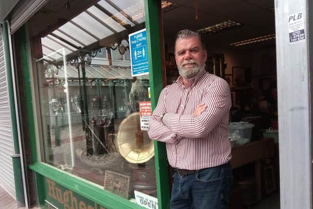 Chris Hughes outside his Hughes'd antiques shop which he has re-opened today