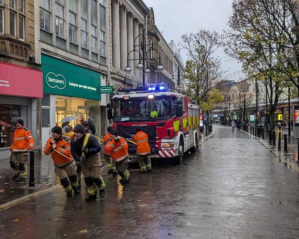 Fire crews haul the engine through the centre of Doncaster.