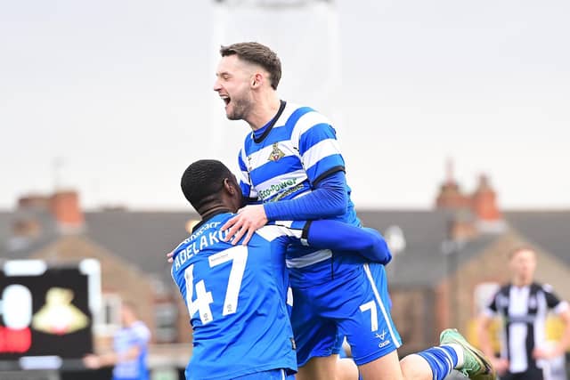 Luke Molyneux celebrates Rovers' opener with Hakeeb Adelakun.
