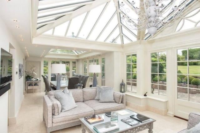 This is another of the reception rooms across the house that lets in a lot of natural light with it's large windows.