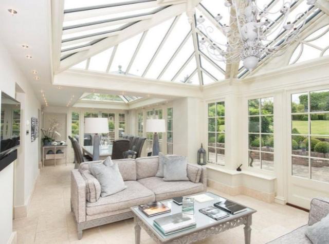 This is another of the reception rooms across the house that lets in a lot of natural light with it's large windows.