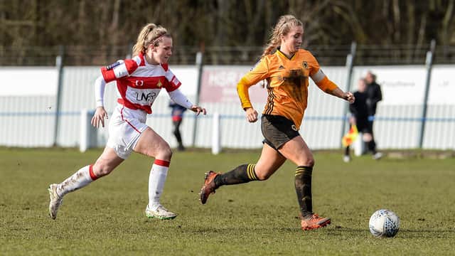 Belles in action against Wolves.