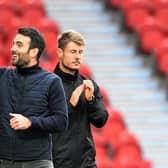 Doncaster's manager Danny Schofield celebrates his first victory.