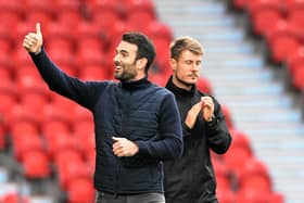 Doncaster's manager Danny Schofield celebrates his first victory.