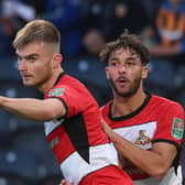 Doncaster's George Miller celebrates his goal.