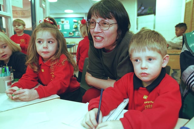Nursery teacher Cheryl Bell pictured with , left, Brooke Ward, four, and Callum Styring, three, at Reignhead Nursury, Beighton in 1999