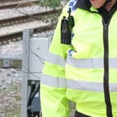 A man has died at a South Yorkshire railway station after being struck by a train, British Transport Police have announced. File picture shows a British Transport Police officer . picture: Dean Atkins