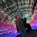 TV presenter Helen Skelton explores the light tunnel.