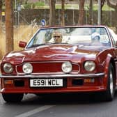 The Beckham's enjoying a trip in the classic car.