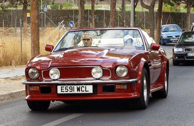 The Beckham's enjoying a trip in the classic car.