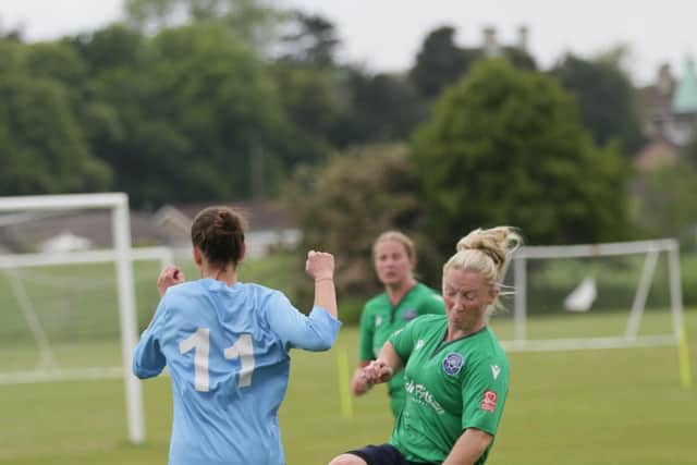Hayley Wood (green) in action for AFC Bentley Women.