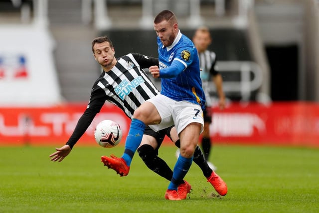Aaron Connolly of Brighton and Hove Albion is challenged by Javier Manquillo of Newcastle United.