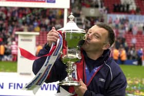 Dave Penney celebrates guiding Doncaster Rovers back to the Football League in 2003.